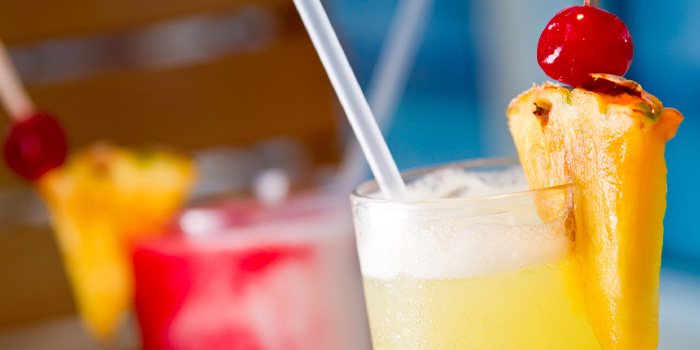 Image of tropical cocktails with pineapple and cherry, from Ocean's Restaurant, the best restaurant on Panama City Beach!